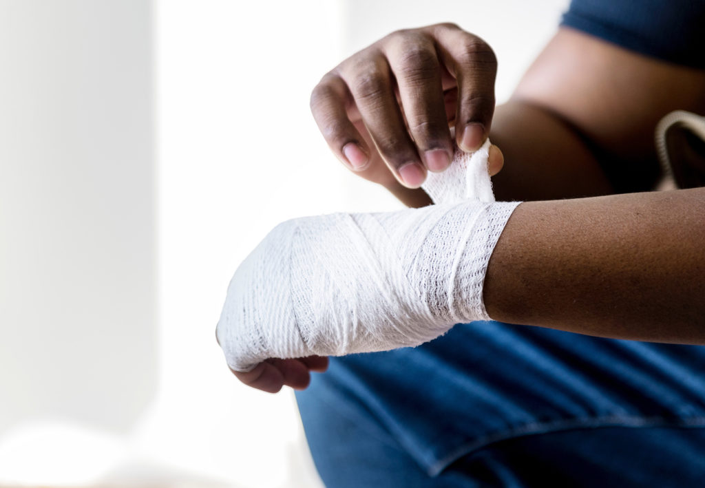 A person with a bandaged wrist